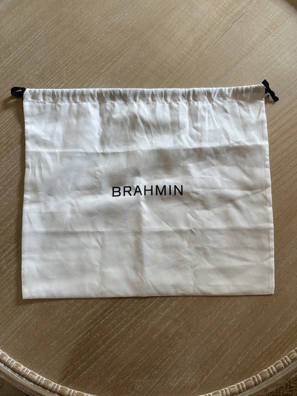 Brahmin Cream Cotton Drawstring Bag with Black Logo Text